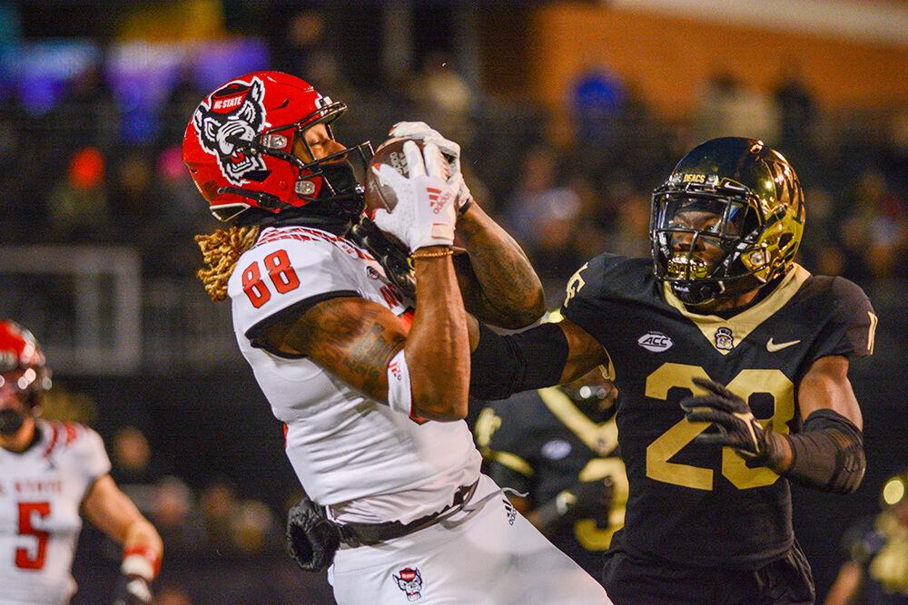 Redshirt sophomore wide receiver Devin Carter makes a catch over a Wake Forest cornerback on Saturday, Nov. 13, 2021 at Truist Field in Winston-Salem. The Wolfpack&#160;lost to the Demon Deacons 45-42.