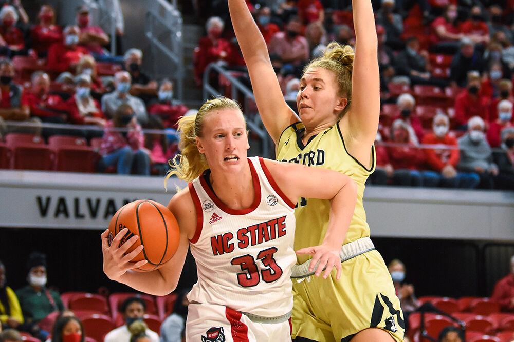 Senior center Elissa Cunane pushes her way past a Wofford Terrier player on Friday, Nov. 12, 2021 in Reynolds Coliseum. Cunane made 13 points and had 7 rebounds in the game. NC State won 90-57.