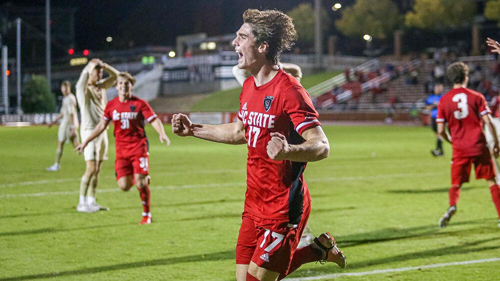 Freshman midfielder Luke Hille celebrates after his header scores the golden goal during the game against Boston College.NC State took down Boston College 1-0 in the second overtime period in Dail Soccer Stadium on Friday, Oct. 29, 2021.
