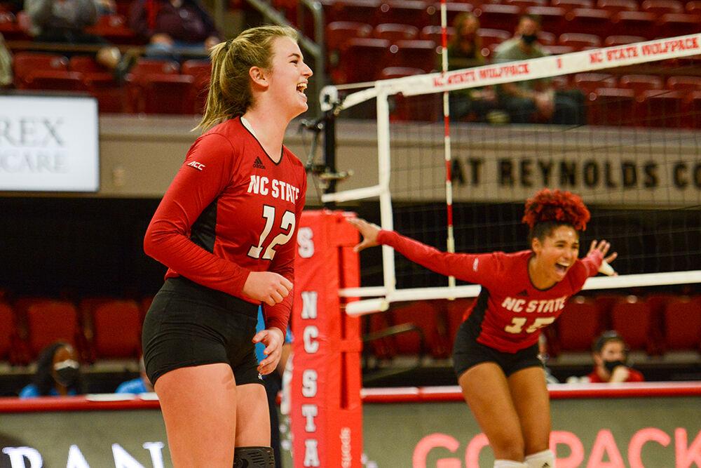 Redshirt junior outside hitter Taylor Rowland and senior outside hitter Jade Parchment celebrate a point during NC State's match against Notre Dame on Sunday, Nov. 7, 2021 in Reynolds Coliseum. Rowland and Parchment led the Wolfpack in kills against the Irish with 25 and 22 kills respectively. The Wolfpack beat the Irish 3-2.
