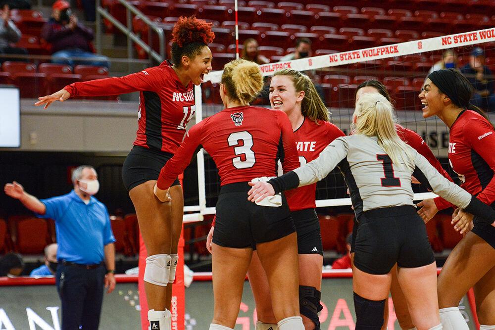 Senior outside hitter Jade Parchment jumps with joy as she celebrates with her team during NC State's match against Notre Dame on Sunday, Nov. 7, 2021 in Reynolds Coliseum. The Wolfpack had 77 kills against the Irish during the 3-2 Wolfpack win.