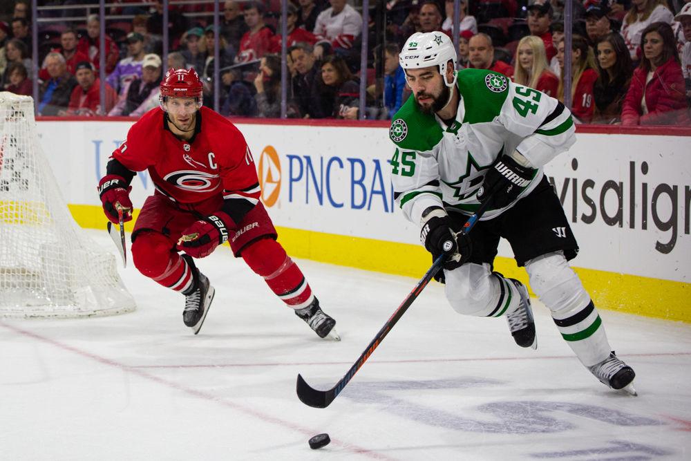 Stars defenseman Roman Polak dribbles while chased by Hurricanes center Jordan Staal on Tuesday, Feb. 25, 2020 at PNC Arena. Polak had three hits in 21 shifts in the 4-1 win over the Carolina Hurricanes