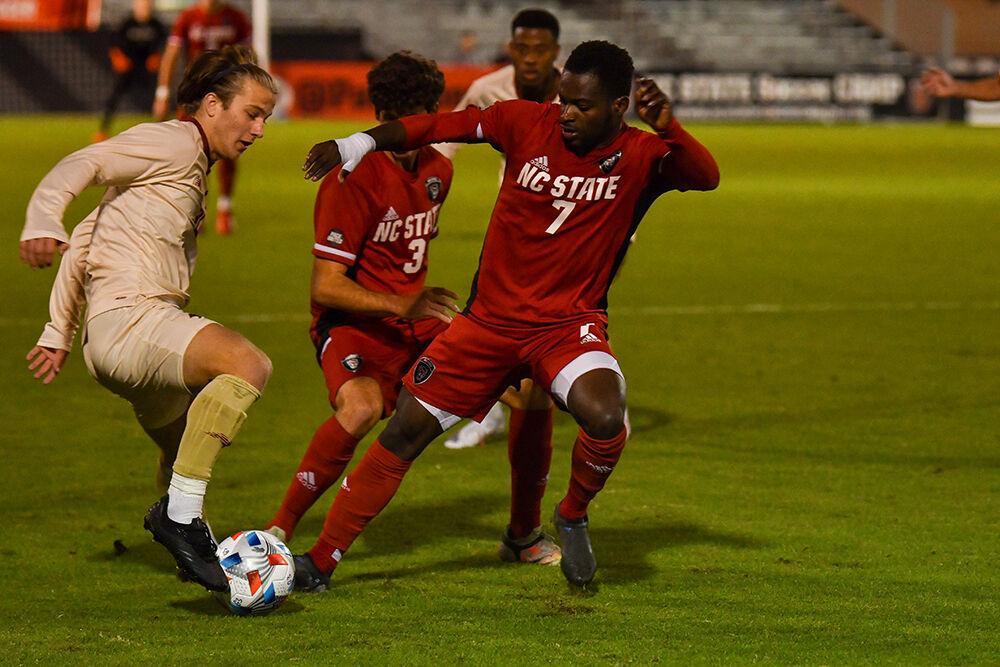 Senior forward Ivy Brisma tackles the ball against Boston College on Friday, Oct 29, 2021 at Dail Soccer Field. NC State won 1-0 during the second overtime.