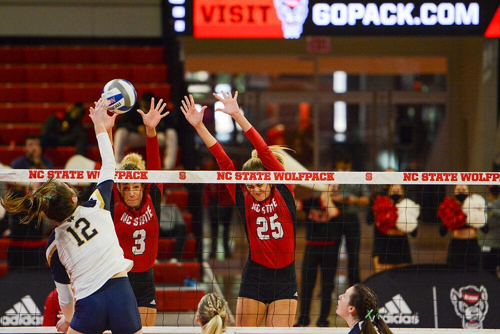 Graduate opposite hitter Melissa Evans and sophomore middle blocker Riley Shaak jump to block during NC State match against Notre Dame on Sunday, Nov. 7, 2021 in Reynolds Coliseum. Evans and Shaak led the Wolfpack in blocks against the Irish, with five and six blocks, respectively. NC State won 3-2 against Notre Dame.