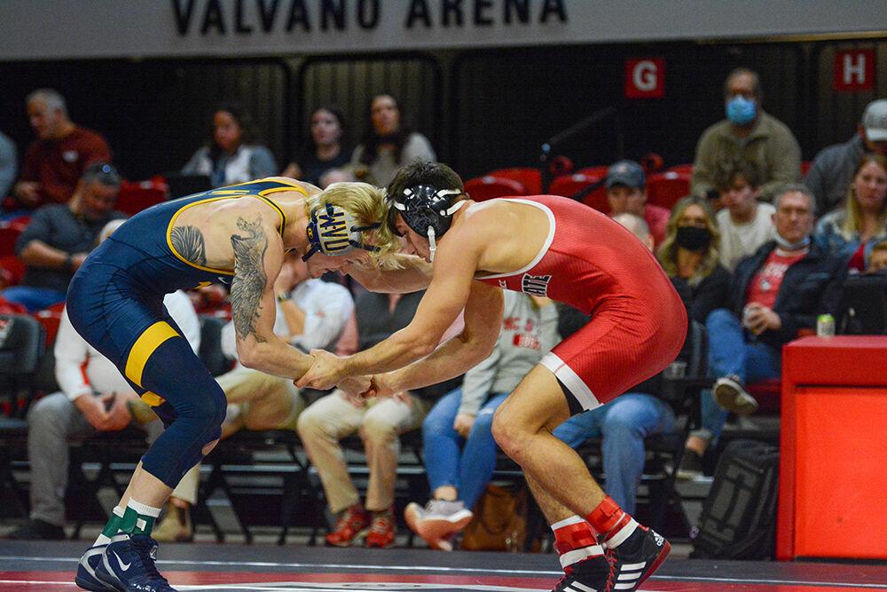 Freshman Ryan Jack begins his match against his opponent during the NC State meet against West Virginia on Sunday, November 21, 2021 in Reynolds Coliseum. Jack won his individual match against the Mountaineers 8-7.&#160;The Pack beat the Mountaineers 34-6.