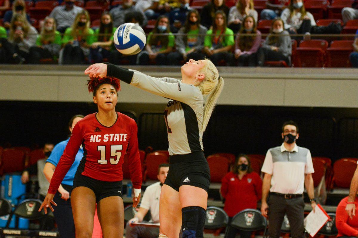 Graduate student libero Kaylee Frazier hits the ball during NC State's match against Notre Dame on Sunday, Nov. 7, 2021 in Reynolds Coliseum. Frazier had five assists against the Irish during the Wolfpack's 3-2 win.