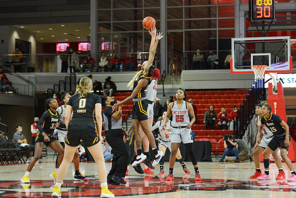 Senior center Elissa Cunane reaches the ball before her Towson counterpart. Cunane's 15 points contributed to a 100-52 victory over Towson at the William Reynolds coliseum on Monday, Nov. 15, 2021.