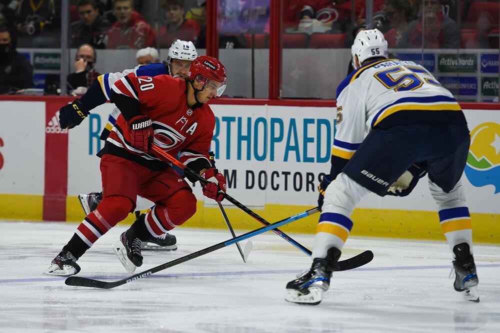 Right wing Sebastian Aho controls the puck while attempting to get past a St. Louis Blues player during the game in PNC Arena on Saturday, Nov. 13, 2021. The Hurricanes won 3-2. Aho had 1 goal and 1 assist.