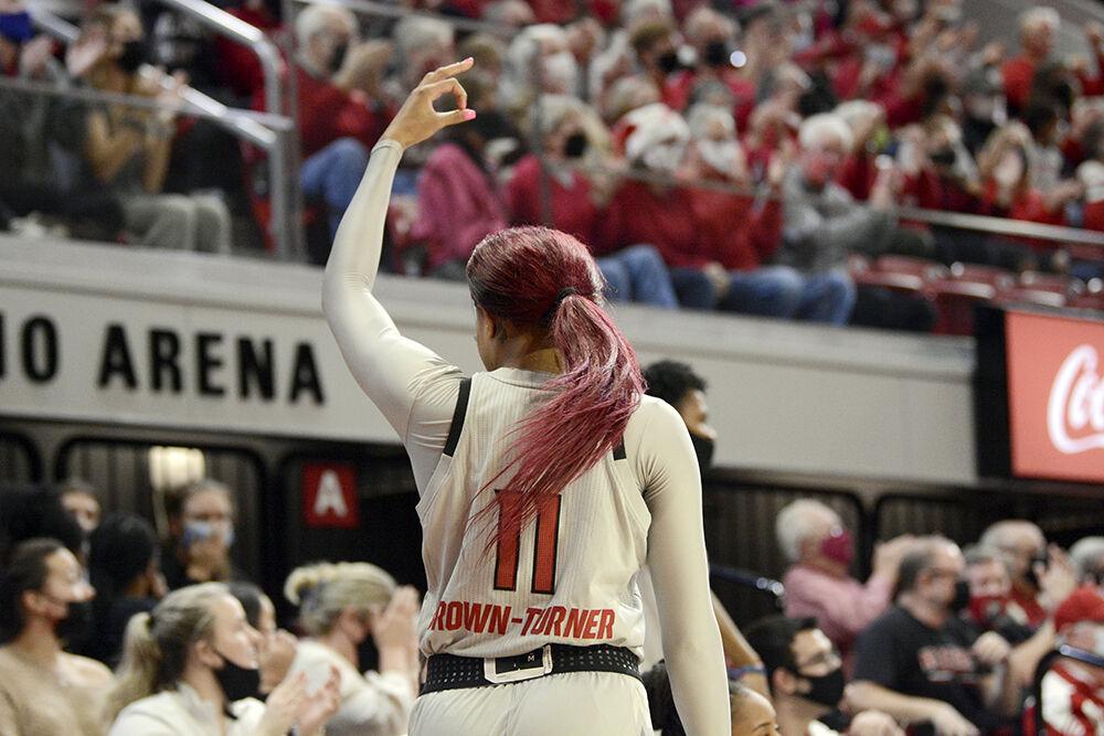 Junior wing Jakia Brown-Turner celebrates after a teammate makes a shot against Georgia on Thursday, Dec. 16, 2021. The Wolfpack lost to the Bulldogs 82-80 in overtime.