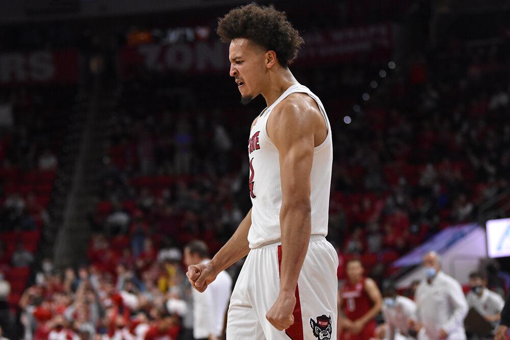 Senior forward Jericole Hellems celebrates after he scores in the game against Nebraska in PNC Arena on Wednesday, Dec. 1, 2021. Hellems scored 15 points and had seven rebounds. NC State won in quadruple overtime 104-100.