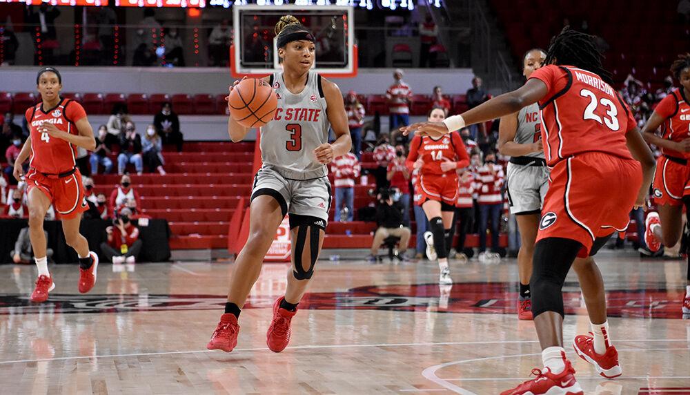 Graduate guard Kai Crutchfield looks for an open teammate during the game against Georgia on Thursday, Dec. 16, 2021 at Reynolds Coliseum. Crutchfield scored 10 points during the game. NC State lost to Georgia 82-80.
