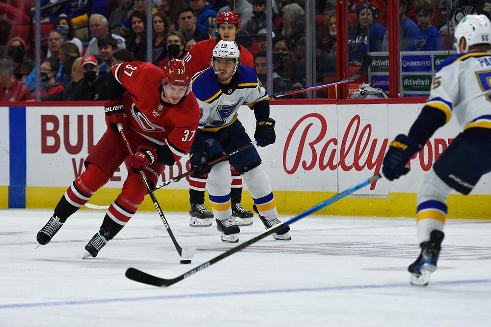 Right wing Andrei Svechnikov carries the puck to the opposing side in the game against the St. Louis Blues in PNC Arena on Saturday, Nov. 13, 2021. The Hurricanes won 3-2.