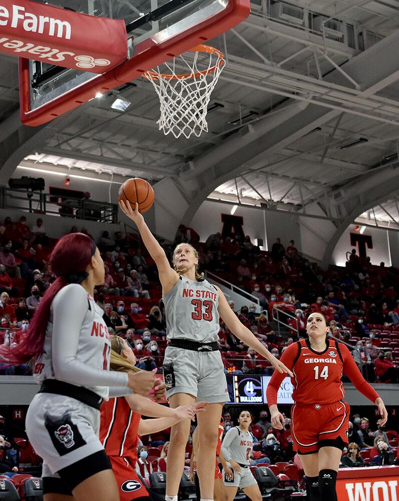 Senior center Elissa Cunane goes in for a layup against Georgia at Reynolds Coliseum on Thursday, Dec. 16, 2021. Cunane scored 20 points and had 3 personal fouls during the game. NC State lost to Georgia 82-80 in overtime.