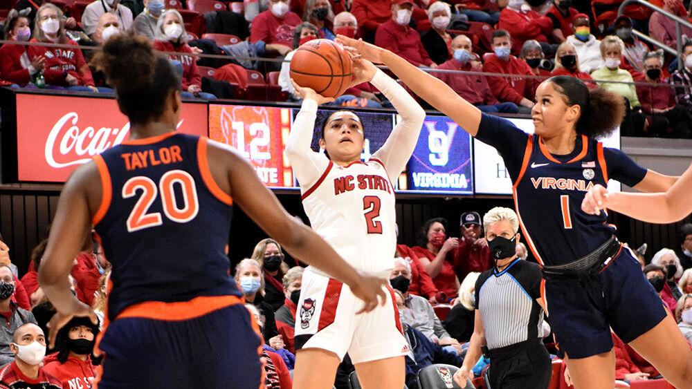 Graduate guard Raina Perez takes a shot against Virginia at Reynolds Coliseum on Sunday, Dec. 19, 2021. Perez scored 23 points before turning her ankle in the fourth quarter. NC State beat Virginia 82-55.