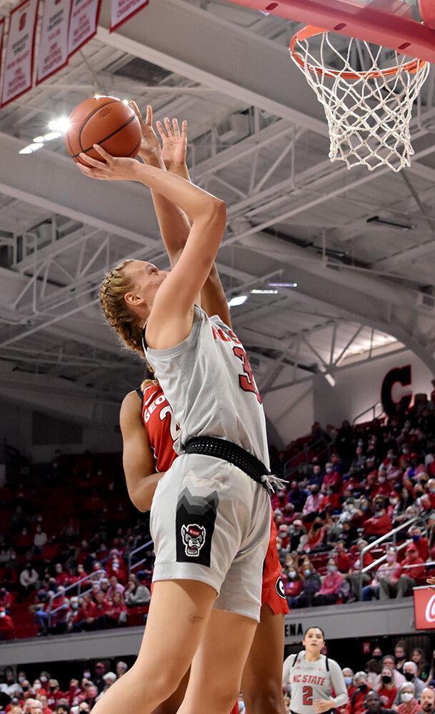 Senior center Elissa Cunane puts up a shot during the game against Georgia at Reynolds Coliseum on Thursday, Dec. 16, 2021. Cunane scored 20 points but the Wolfpack lost the Bulldogs 82-80 in overtime.