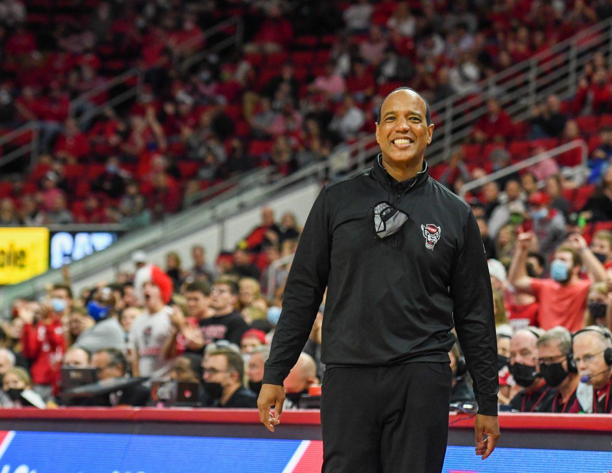 Head coach Kevin Keatts smiles after a succcessful drive from the Wolfpack during the game versus the Bucknell Bisons on Tuesday, Nov. 9, 2021 in PNC Arena. The Wolfpack beat the Bisons 88-70.