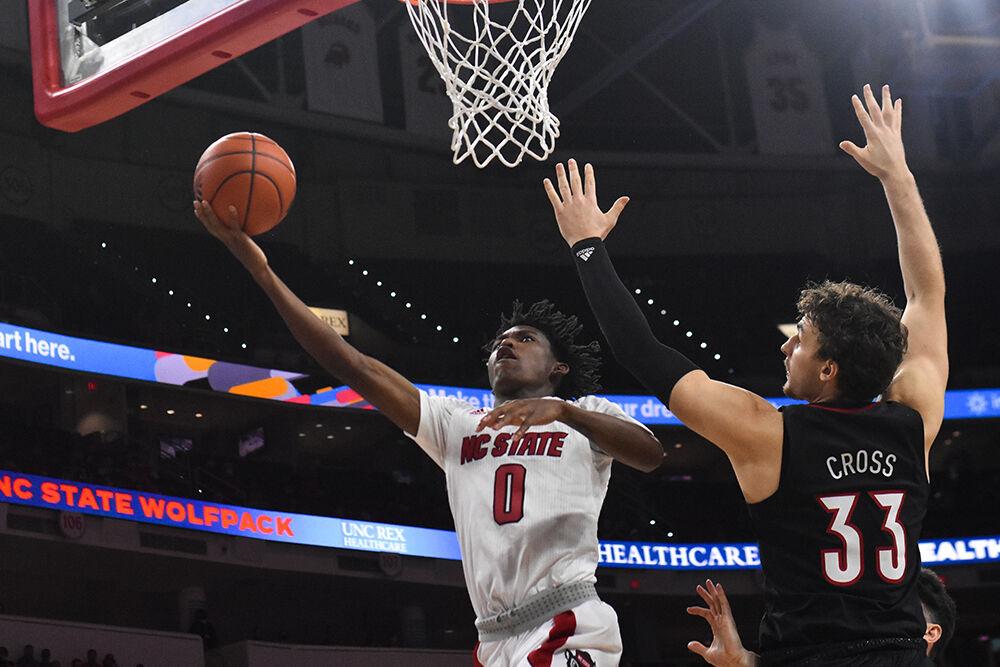 Freshman guard Terquavion Smith goes for a layup in the game against the Louisville Cardinals in PNC Arena on Saturday, Dec. 4, 2021. Smith scored 17 points in the game. The Wolfpack lost 73-68.