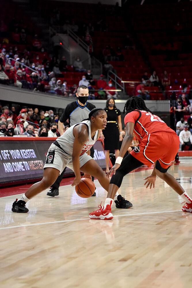 Sophomore guard Diamond Johnson dribbles the ball during the game against Georgia on Thursday, Dec. 16, 2021 at Reynolds Coliseum. Johnson scored 17 points and had 4 rebounds during the game. The Wolfpack lost to the Bulldogs 82-80 in overtime.