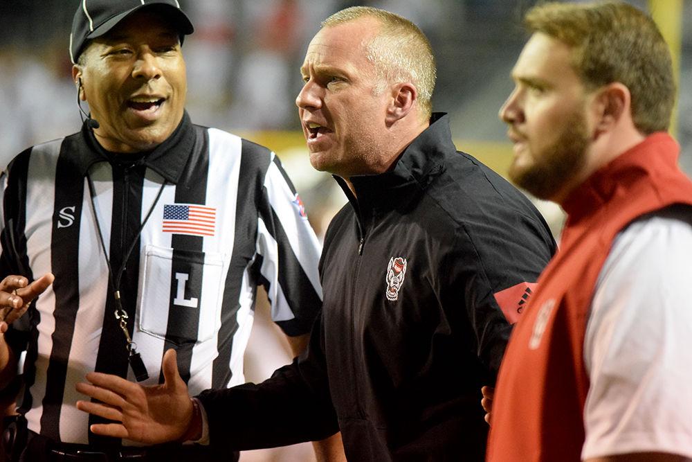 Head coach Dave Doeren yells at the refs for a call at the end of the game against Syracuse on Thursday, October 10, 2019 in Carter-Finley Stadium. The Pack beat the Orange 16-10.