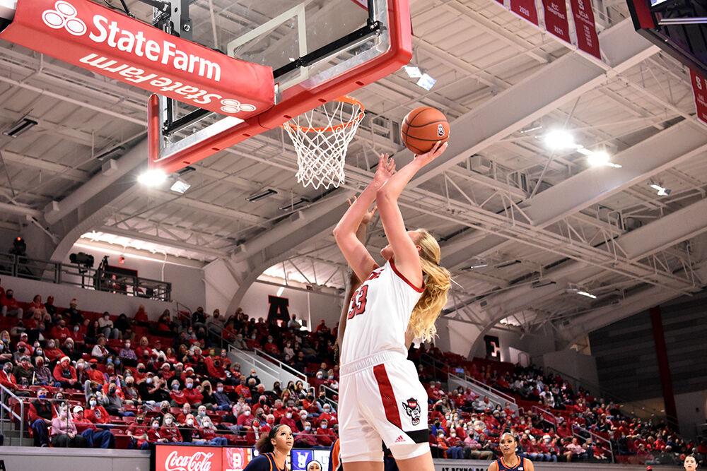 Senior center Elissa Cunane takes a layup against Virginia at Reynolds Coliseum on Sunday, Dec. 19, 2021. NC State beat Virginia 82-55.