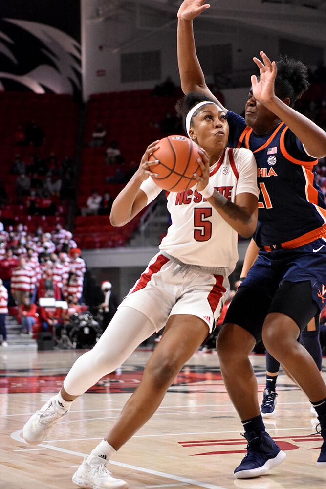 Junior forward Jada Boyd boxes out a Virginia defender while driving toward the paint at Reynolds Coliseum on Sunday, Dec, 19, 2021. The Wolfpack beat the Cavaliers 82-55.