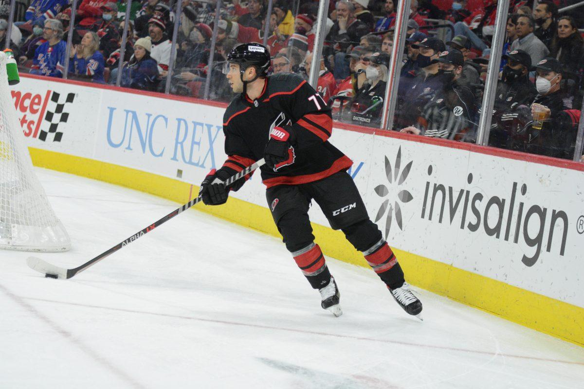 Tony DeAngelo takes the puck out of the trapezoid during a 6-3 win over the New York Rangers in PNC Arena on Friday, Jan. 21, 2022.