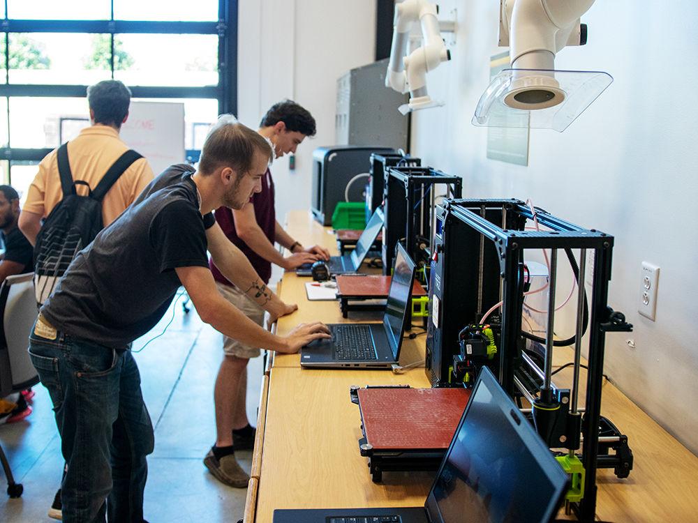 Students work at the 3D printers that are offered at the Entrepreneurship Garage on Friday, Sep. 20, 2019 at Partners I. The garage serves as a think tank for student entrepreneurs.