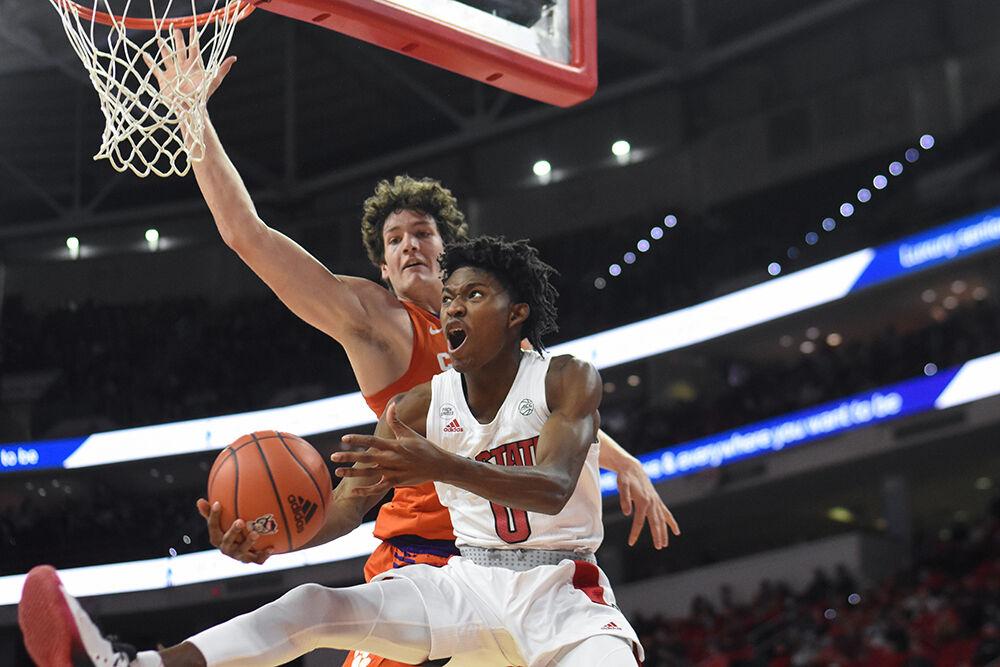 Freshman guard Terquavion Smith goes for a shot in the game against Clemson on Saturday, Jan. 8, 2022&#160;in PNC Arena. Smith had 3 rebounds. NC State lost to Clemson 70-65.