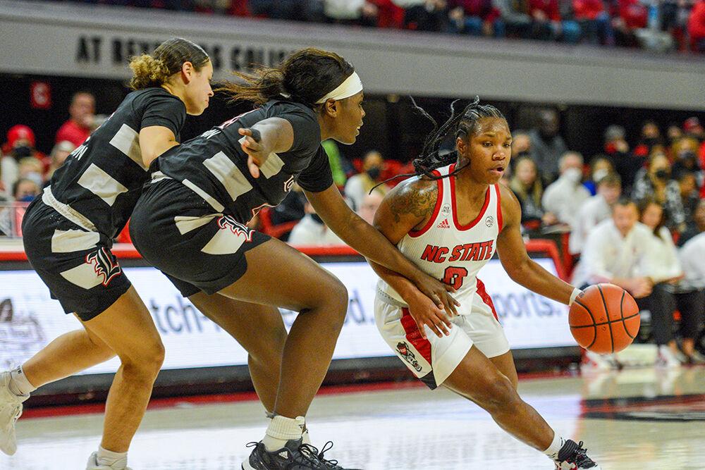 Sophomore guard Diamond Johnson moves down the court in the game against Louisville on Thursday, Jan. 20, 2022 in Reynolds Coliseum. Johnson led the team as she made three 3-pointers and six rebounds during the game. The Wolfpack pulled out a win over the Cardinals 68-59.