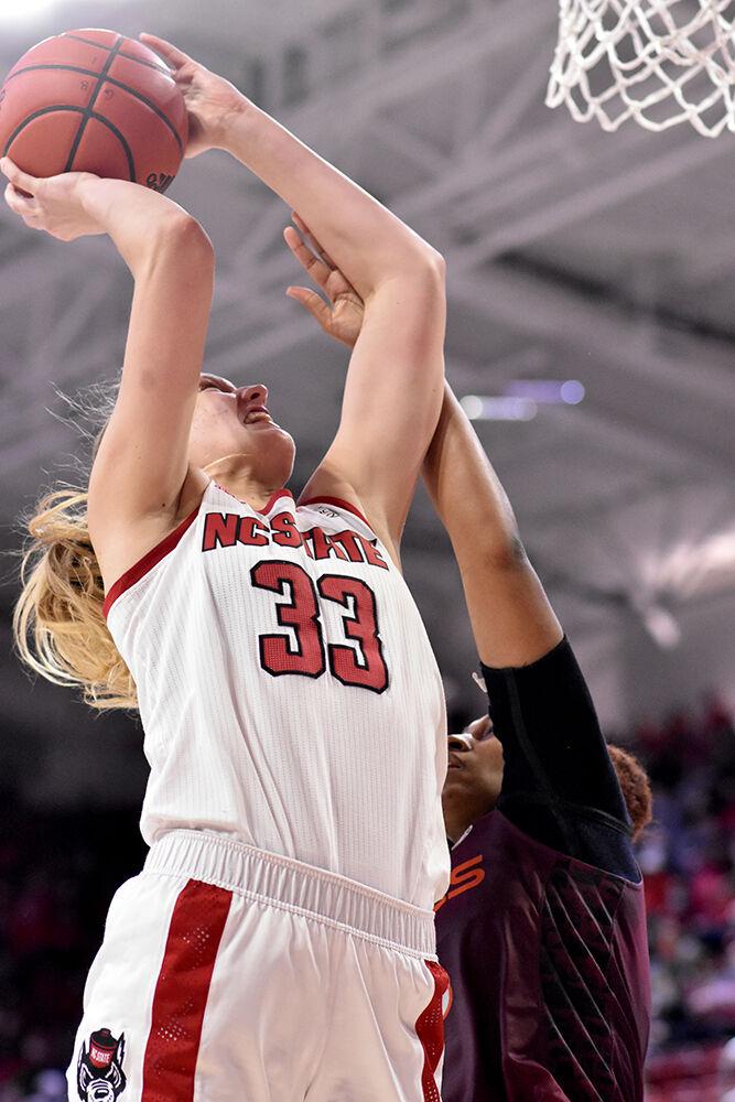 Senior center Elissa Cunane takes a shot against Virginia Tech on Sunday, Jan. 23, 2022 at Reynolds Coliseum. Cunane scored seven points during the game. NC State beat Virginia Tech 51-45.