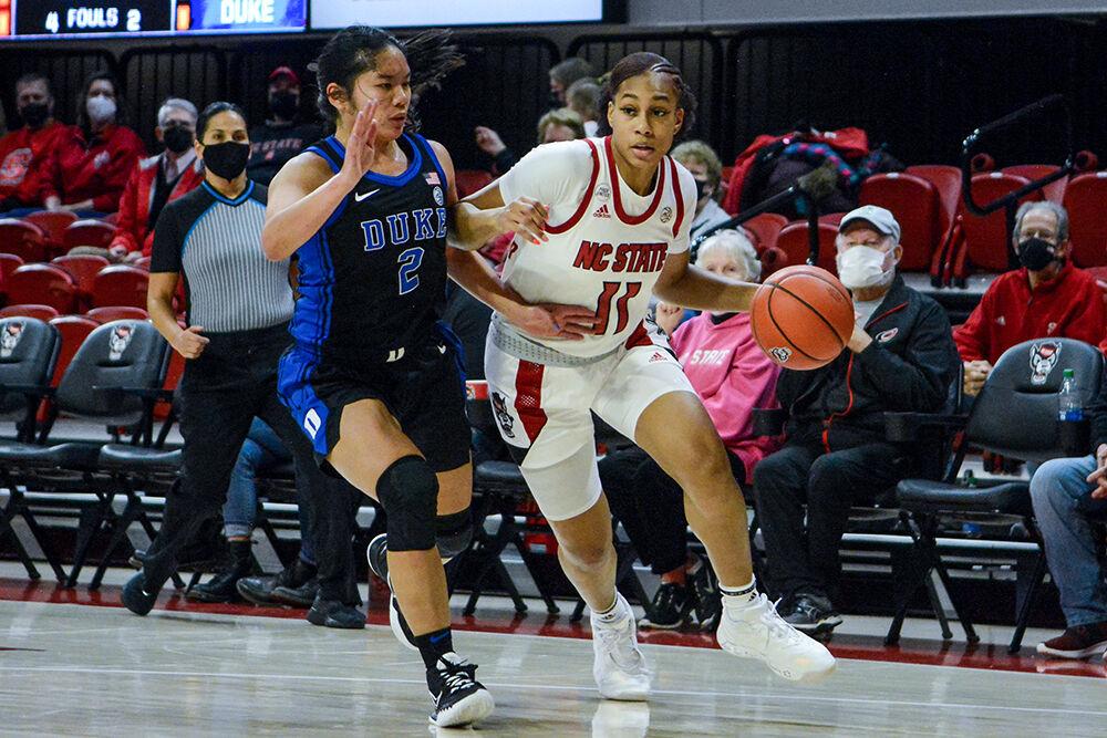 Junior wing Jakia Brown-Turner drives the ball around an opponent in the game against Duke on Sunday, Jan. 16, 2022 in Reynolds Coliseum. Brown-Turner scored seven points and contributed three rebounds. NC State beat Duke 84-60.