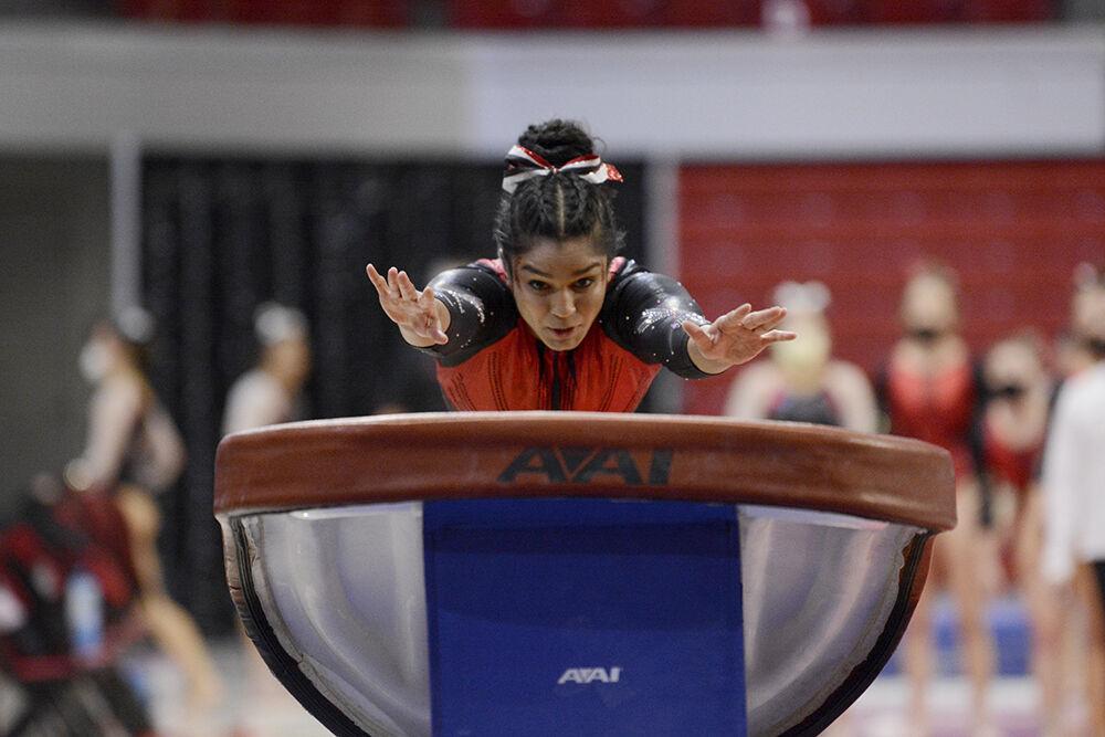 Junior gymnast Shruthi Anand approaches the vaulting table during the first rotation of NC State&#8217;s gymnastics Red and White Exhibition meet. The preseason meet ended with the white team beating the red team 10-7.