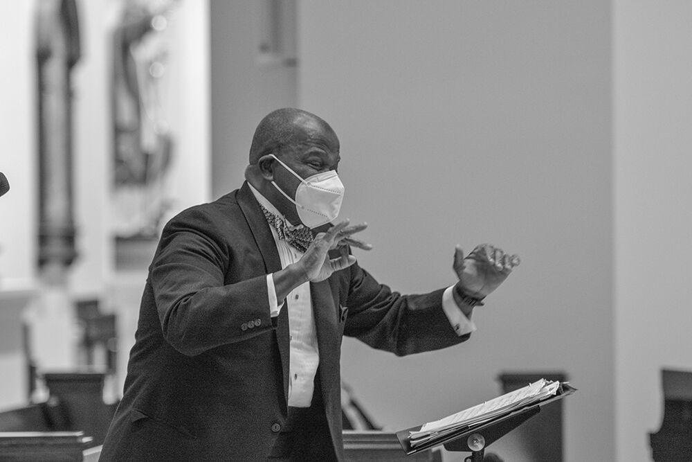 Music director Everett McCorvey leads the American Spiritual Ensemble performance during an NC State LIVE presentation in The Holy Name of Jesus Cathedral on Thursday, Jan. 27, 2022. The ensemble has a mission to preserve and celebrate the American Negro spiritual.