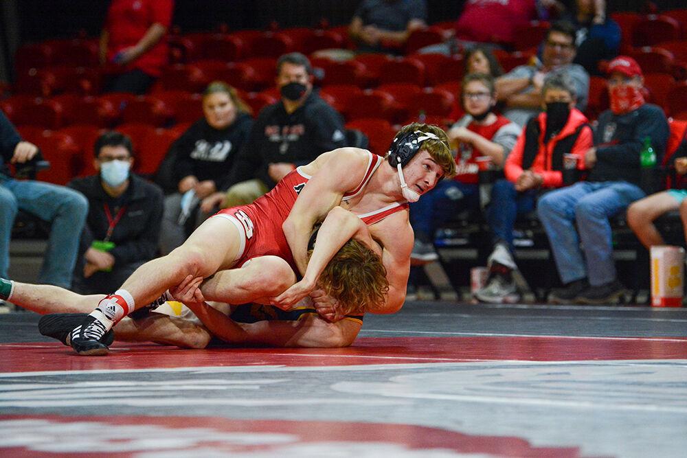 Freshman Ed Scott maintains control during the NC State match against West Virginia on Sunday, November 21, 2021 in Reynolds Coliseum. Scott won his individual match against the Mountaineers 22-8.&#160;The Pack beat the Mountaineers 34-6.