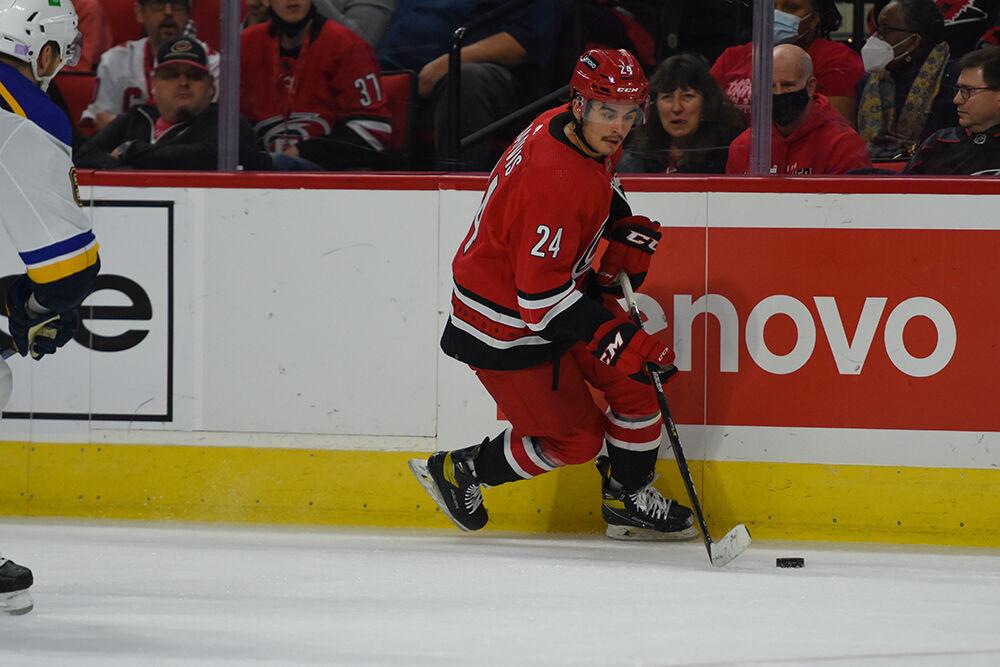 Center Seth Jarvis skates to the puck in the game against the St. Louis Blues in PNC Arena on Saturday, Nov. 13, 2021. The Hurricanes won 3-2.
