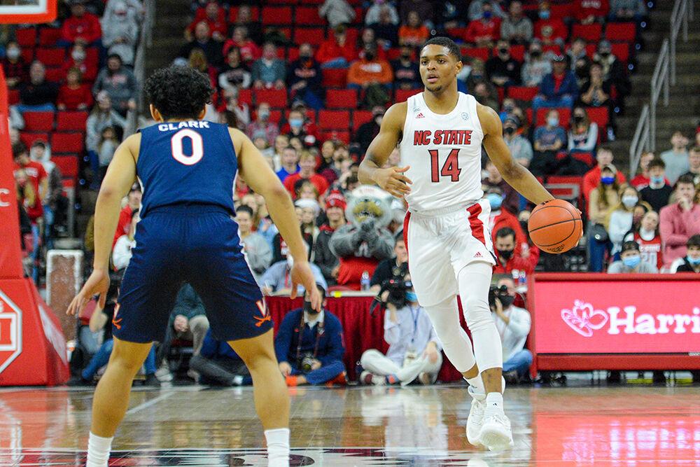 Junior guard Casey Morsell moves down the court in the game against Virginia on Saturday, Jan. 22, 2022 at PNC Arena. Morsell led the team in rebounds, making seven throughout the game. The Wolfpack beat the Cavaliers 77-63.