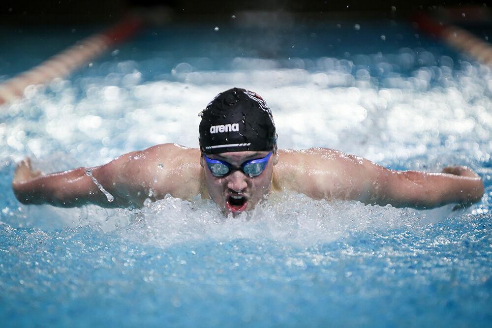 NC State junior Noah Henderson competes in the 200-yard butterfly during the NC State Wolfpack's swimming and diving meet against the Duke Blue Devils on Saturday, Jan. 15, 2022. Henderson won the race with a time of 1:46.01.&#160;The Pack men beat the Blue Devils 167-56.