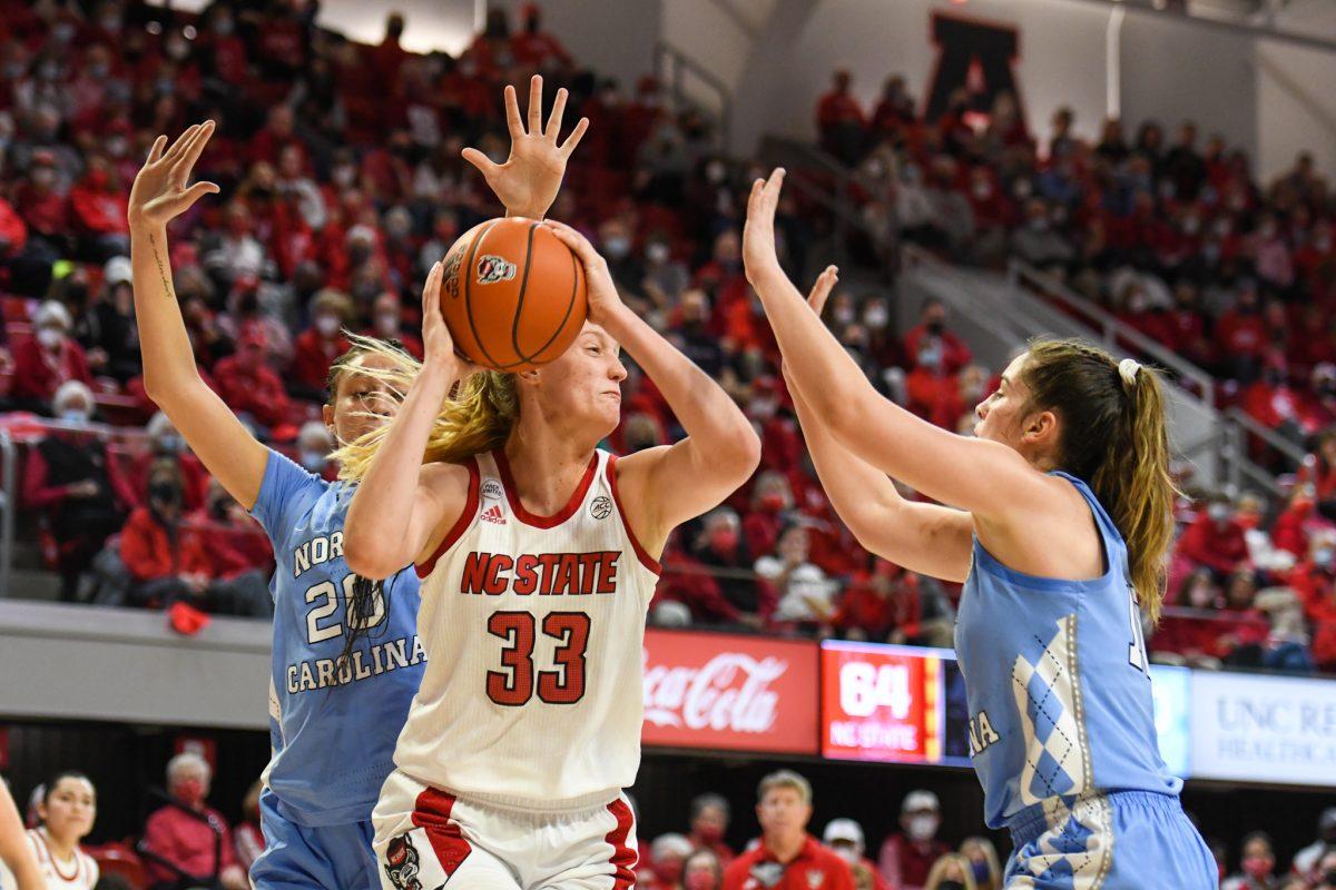 Senior center Elissa Cunane drives to the basket past two defenders during the game versus the UNC Tar Heels on Thursday, Jan. 6, 2021 in Reynolds Coliseum. Cunane scored 19 points and had 13 rebounds against UNC. The Wolfpack beat the Tar Heels 72-45.