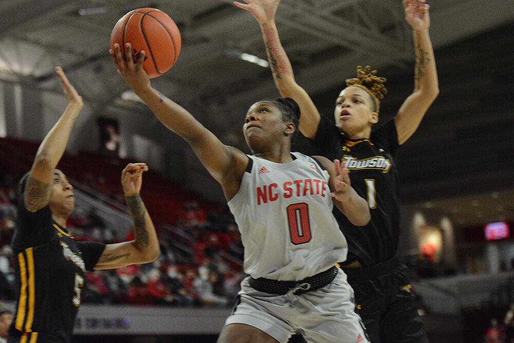 Sophomore guard Diamond Johnson scoops the ball up for a score. Johnson's 16 points helped lead the team to a 100-52 victory over Towson at the William Reynolds coliseum on Monday, Nov. 15, 2021.