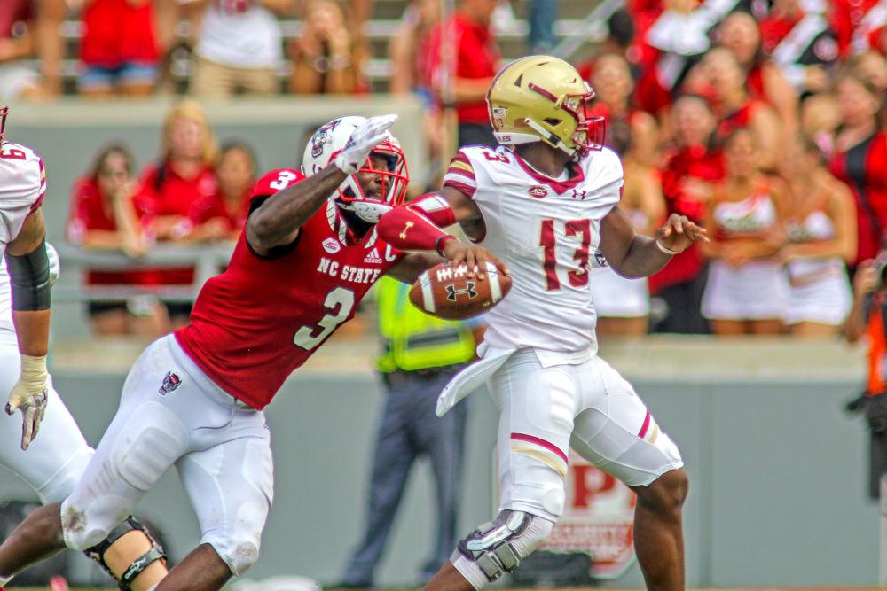 Graduate linebacker Germaine Pratt comes from behind to get the sack on Boston College quarterback Anthony Brown. Pratt had a major day with 1.5 tackles for a loss, the sack, and a forced fumble that he recovered. NC State survived a late Boston College resurgence for a 28-23 win on Saturday, Oct. 6 in Carter-Finley Stadium.