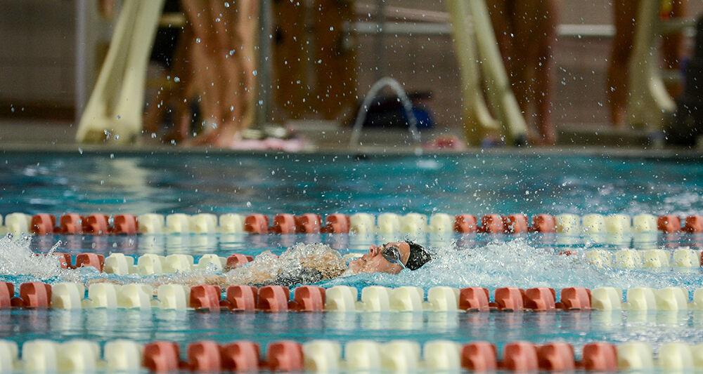 NC State senior Emma Muzzy competes 100-yard backstroke during the NC State Wolfpack's swimming and diving meet against the Duke Blue Devils at the Casey Aquatic Center on Saturday, Jan. 15, 2022.&#160;The Pack women beat the Blue Devils 139-87.