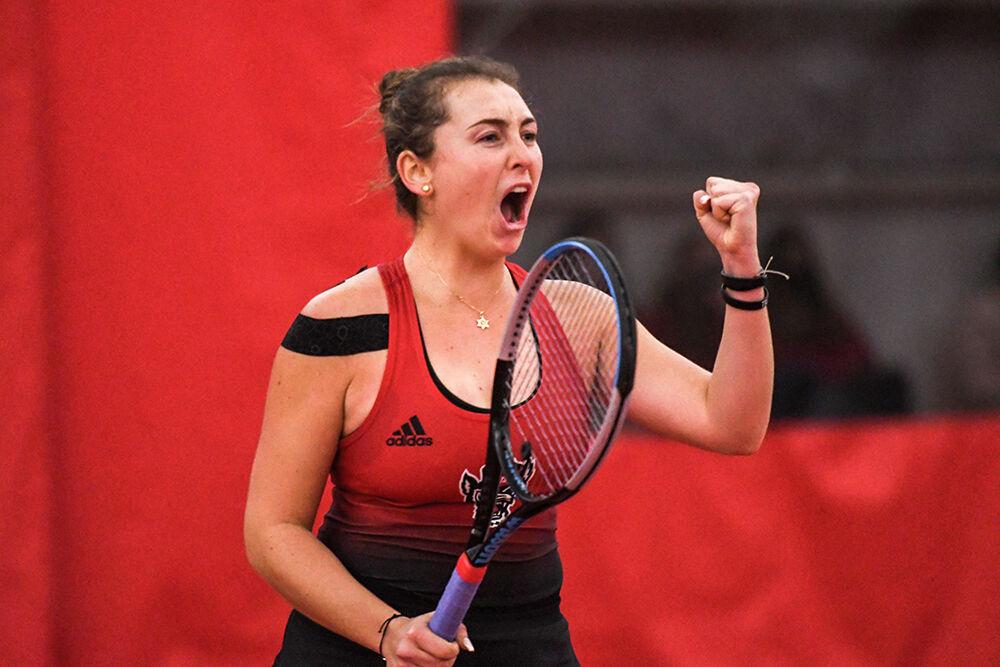 Sophomore Abigail Rencheli celebrates a point during a doubles match against the University of South Carolina on Sunday, Feb. 6, 2022 at J.W. Isenhour Tennis Center. Rencheli and sophomore Amelia Rajecki beat Gamecock players Elise Mills and Megan Davies 6-1. NC State won the match 7-0 versus the University of South Carolina.