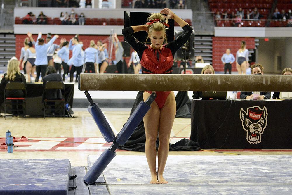 Graduate gymnast Nicole Webb prepares for her performance during the meet against UNC on Saturday, Feb. 19, 2022 at Reynolds Coliseum. NC State lost to UNC 196.625 to 196.350.