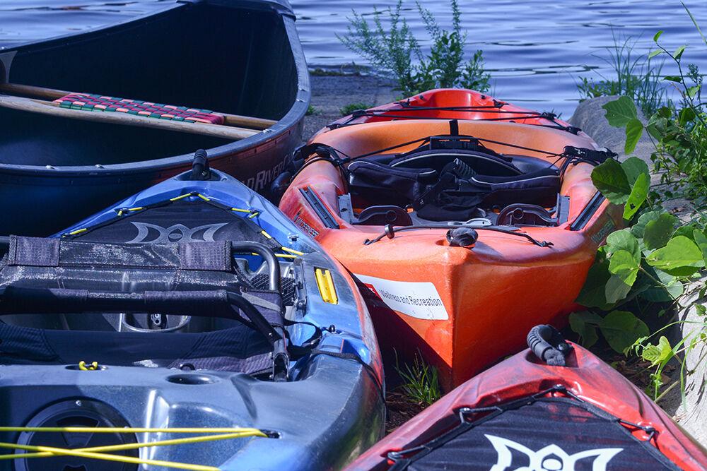 Kayaks sit at Lake Raleigh during Wellness and Recreation's event Paddling at Lake Raleigh Aug. 28, 2021. This allowed NC State students to go out on kayaks, canoes and paddleboards.