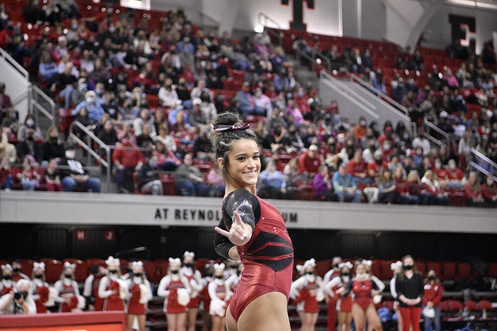 Freshman gymnast Hailey Merchant dances on floor at the meet against UNC on Saturday, Feb. 19, 2022 at Reynolds Coliseum. NC State lost to UNC 196.625 to 196.350.