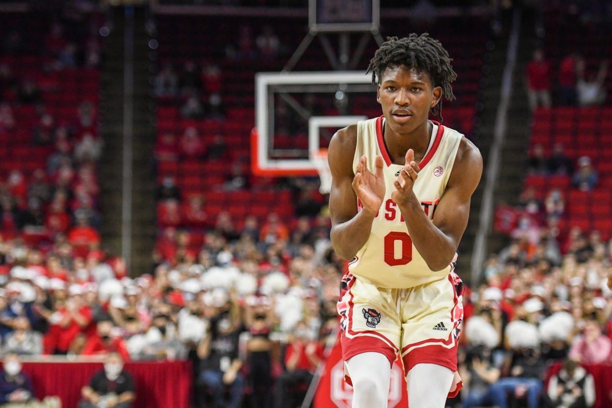 Freshman guard Terquavion Smith claps after making a three pointer during the game versus the Syracuse Orange on Wednesday, Feb. 2, 2022 in PNC Arena. Smith led NC State with 25 points against Syracuse. The Wolfpack lost to the Orange 89-82.
