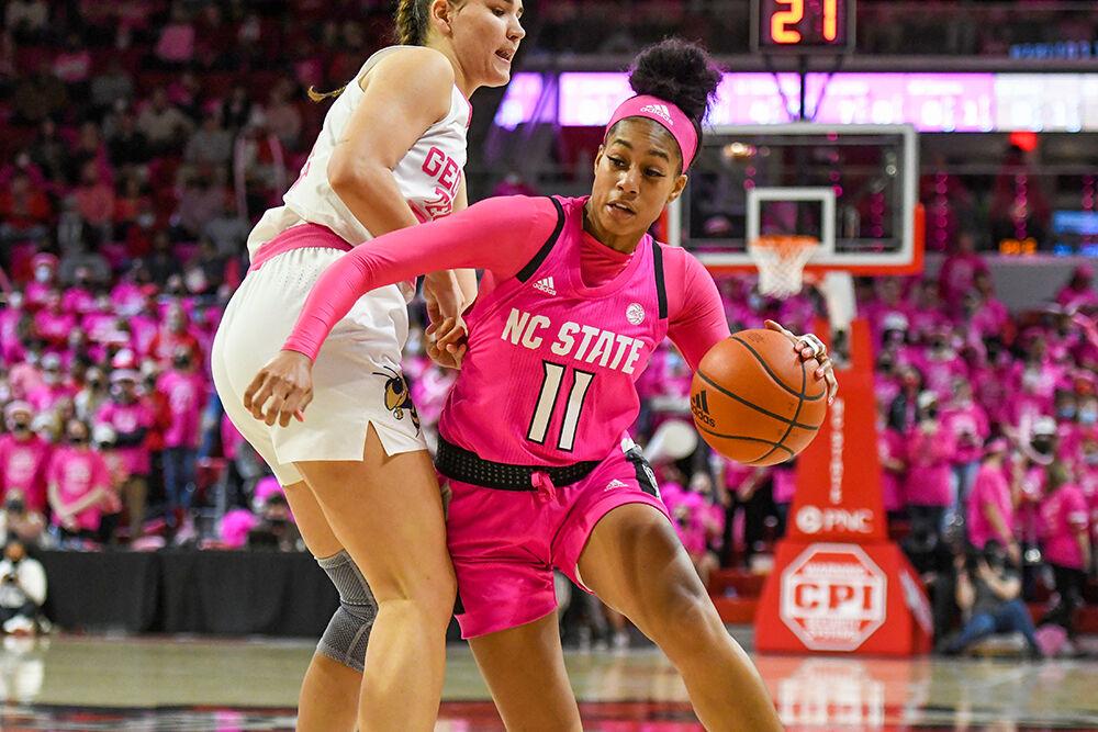 Junior wing Jakia Brown-Turner moves around a Yellow Jacket during the Pack's annual Play4Kay game against Georgia Tech on Monday, Feb. 7, 2022 in Reynolds Coliseum. Brown-Turner made two free throws and one field goal throughout the night. NC State won 59-48 over the visiting Georgia Tech.