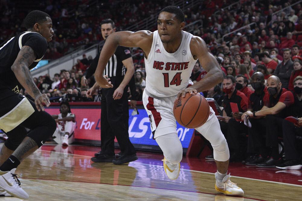 Junior guard Casey Morsell drives to the basket during the game againt the Wake Forest Demon Deacons in PNC Arena on Wednesday, Feb. 9, 2022. Morsell scored two points and had one assist. The Wolfpack lost to the Demon Deacons 69-51.