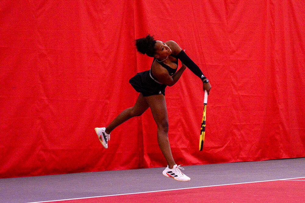 Graduate student Jaeda Daniel follows through with a return during the tennis match against Wake Forest at J.W. Isenhour Tennis Center on Sunday, Jan. 30, 2022. The Wolfpack beat the Demon Deacons 4-0.