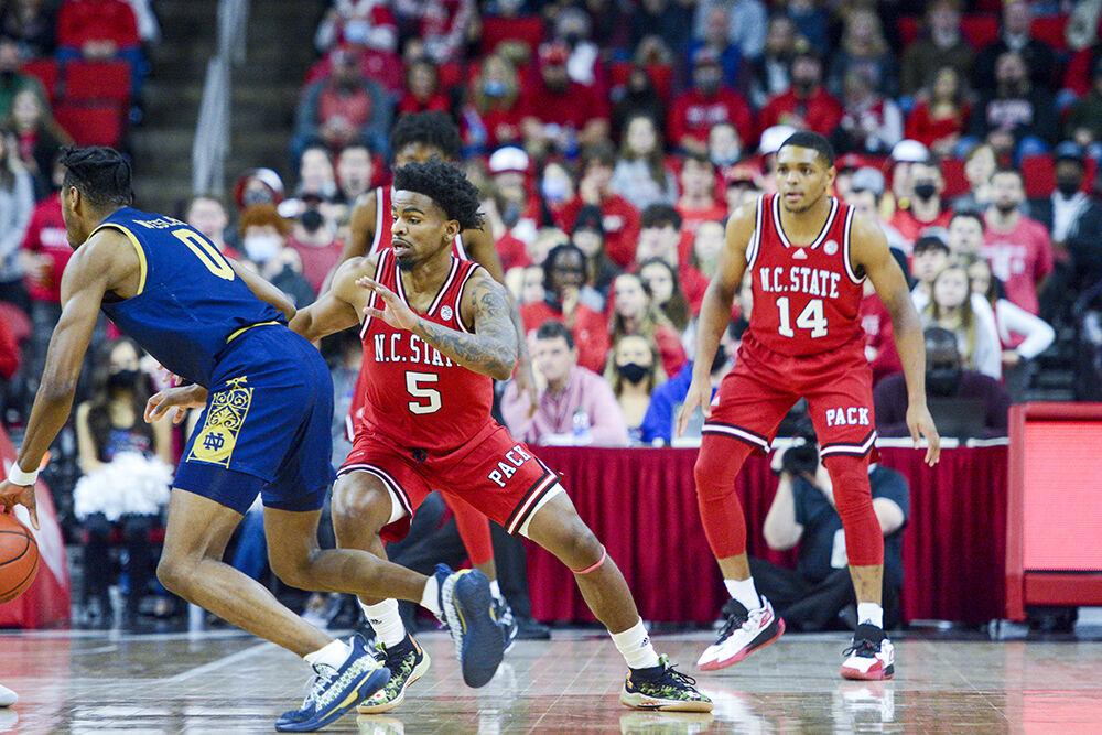 Redshirt senior guard Thomas Allen blocks his opponent from moving towards the goal at the game against Notre Dame at PNC Arena on Saturday, Feb. 5, 2022. Allen earned one rebound during the game. NC State lost to Notre Dame 69-57.